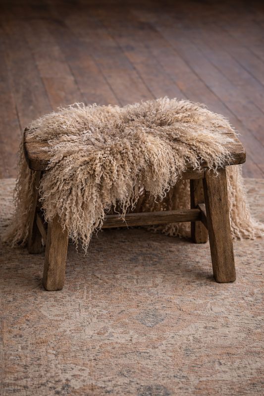 Felted Fleece Rug - 358 Felted fleece rug over a wooden stool