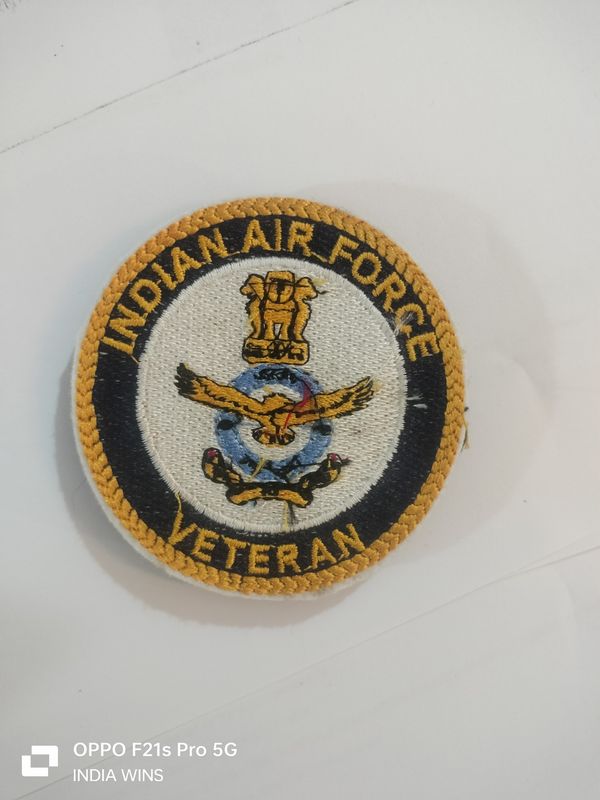 Pocket badge for coats