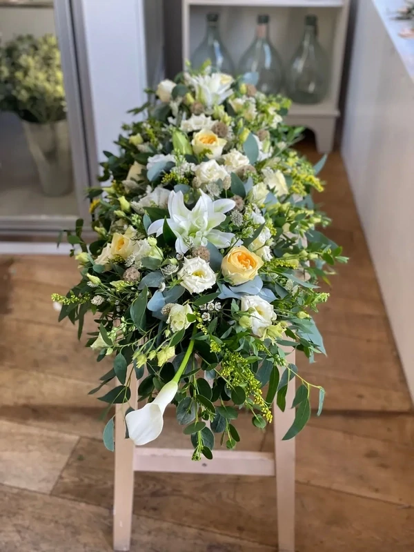 Casket spray, whites and soft yellow
