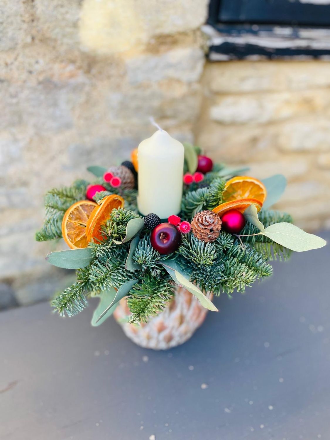 Winter warmth single pillar table arrangement