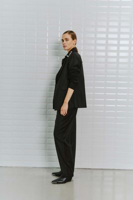 With Black tailored tuxedo pant Adele