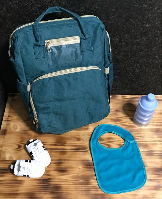 Multifunktionelle Windeltasche mit integriertem Reisebett