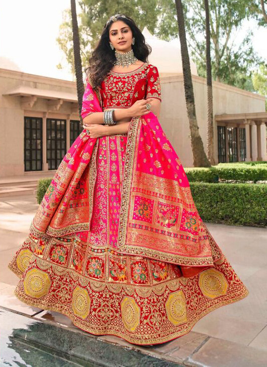 Bridal Wear Stone Embroidered Banarasi Silk Lehenga Choli In Pink Red