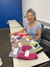 Creation and distribution of knit winter hats by Project Knitwell volunteers
