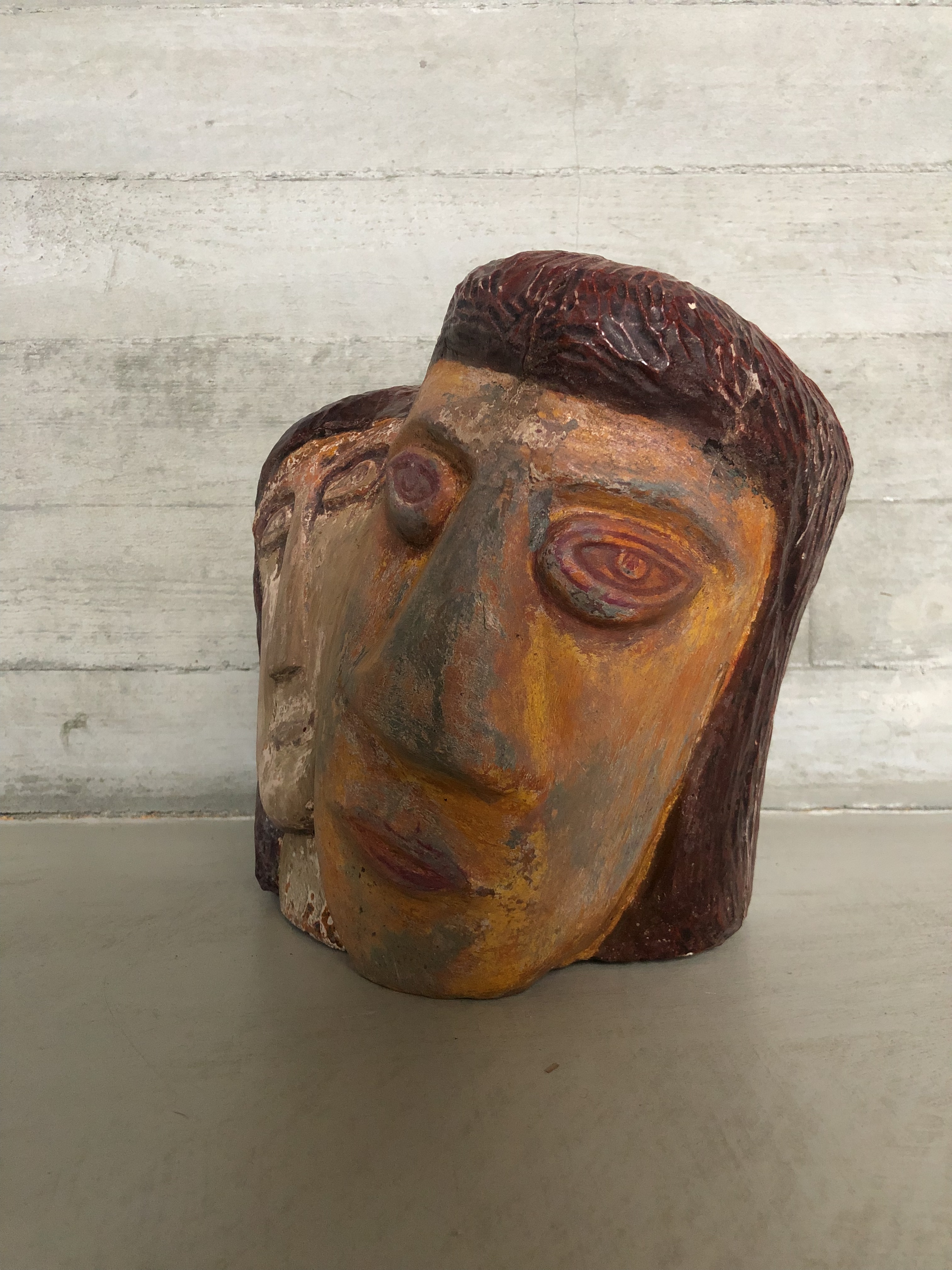 Naieve art sculpture of two heads