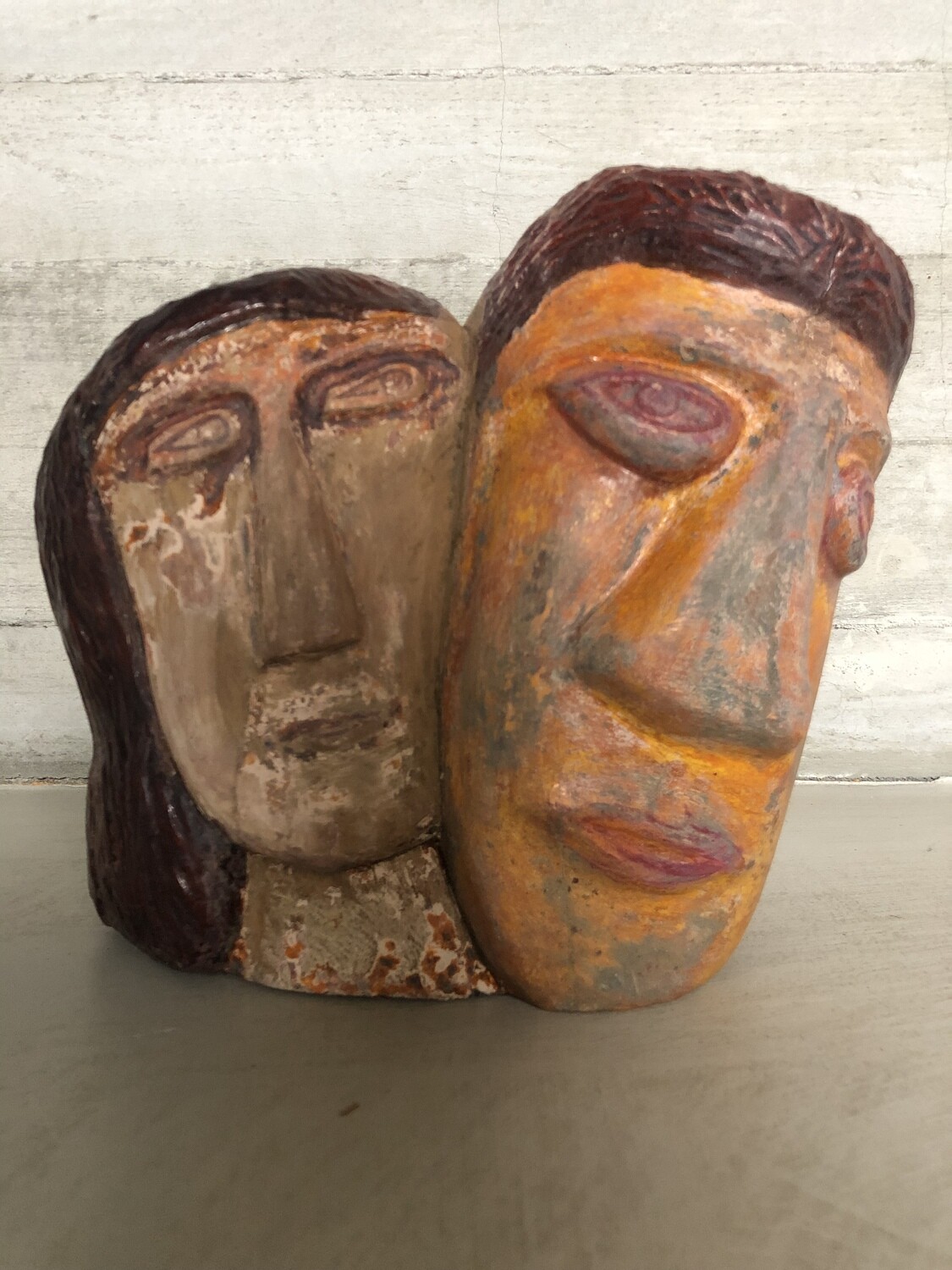Naieve art sculpture of two heads