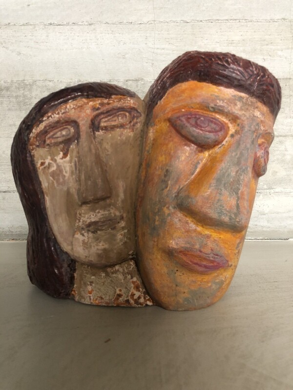 Naieve art sculpture of two heads