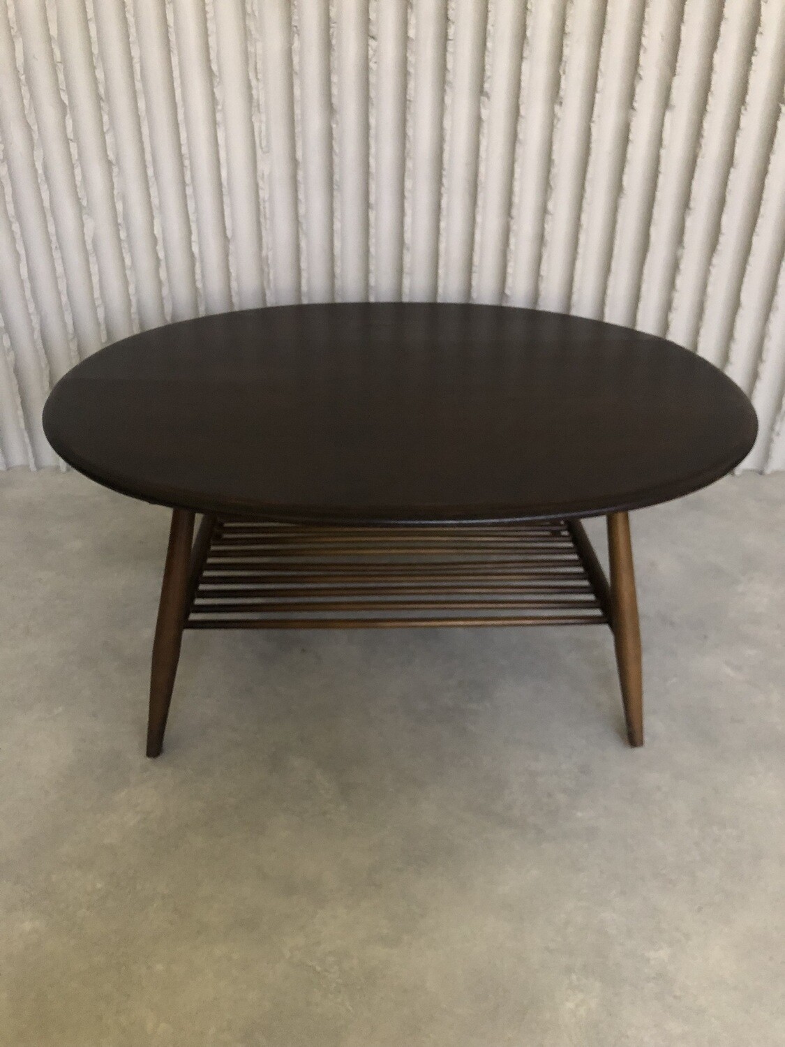 Oval wooden coffee table by Lucian Ercolani