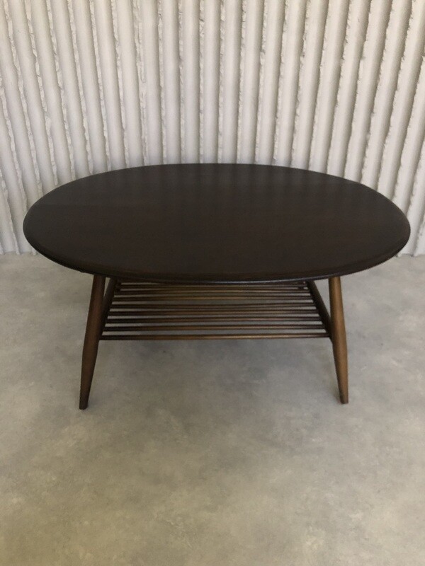 Oval wooden coffee table by Lucian Ercolani