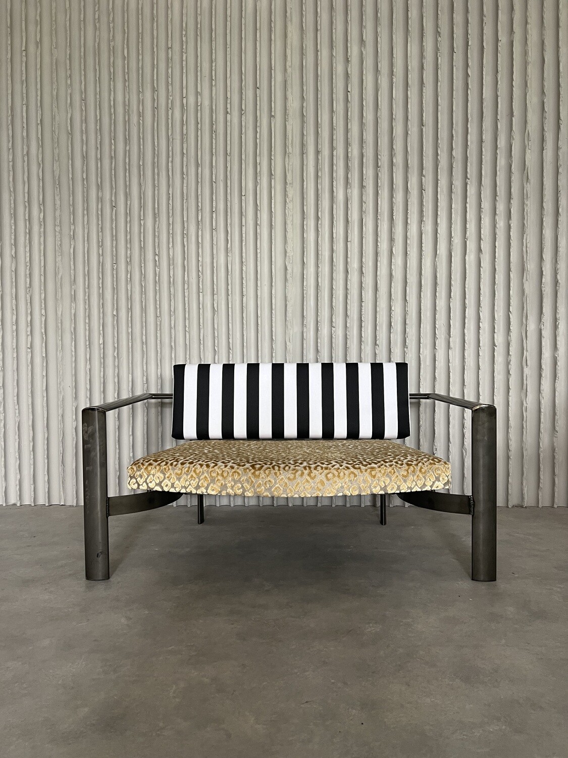 Funky meets rough! Steel loveseat with new upholstery