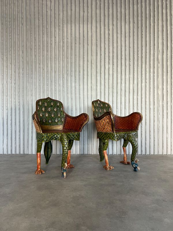 Set of 2  hand carved peacock armchairs.