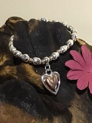 Puffed Heart Silver and Rose Tone Stretch Bracelet