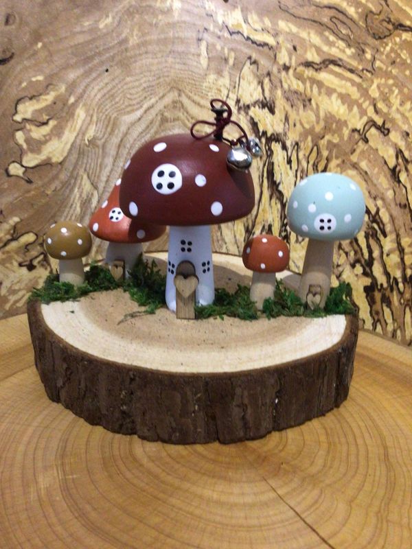 Brown Wooden Toadstool Houses on Log Slice