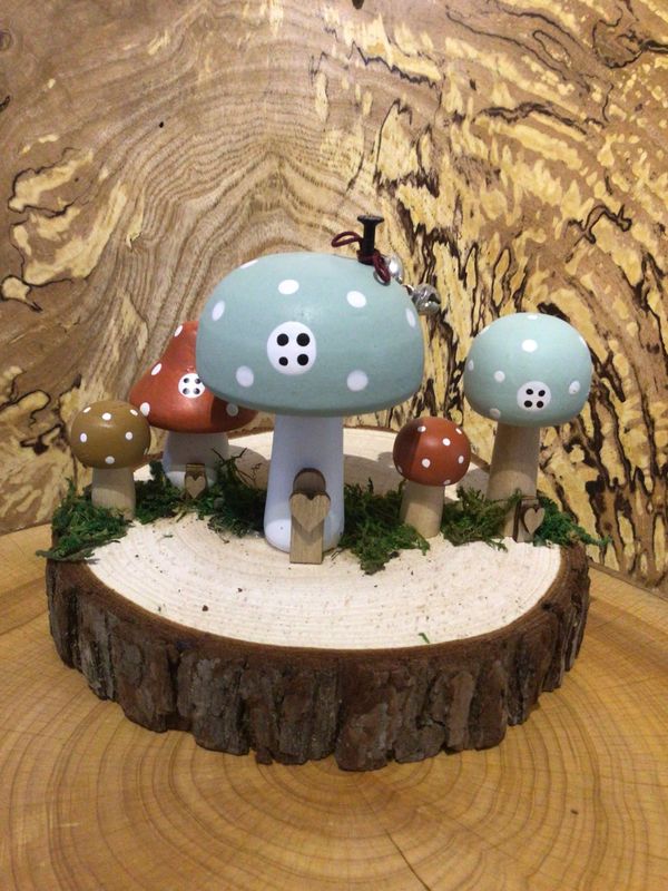 Blue Wooden Toadstool Houses on Log Slice