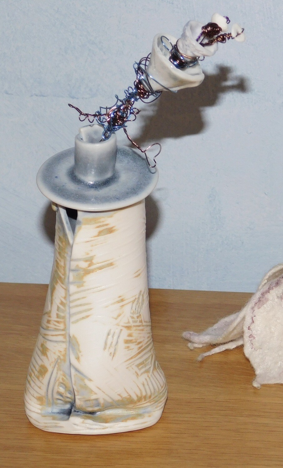 porcelain textured bottle with porcelain flower.