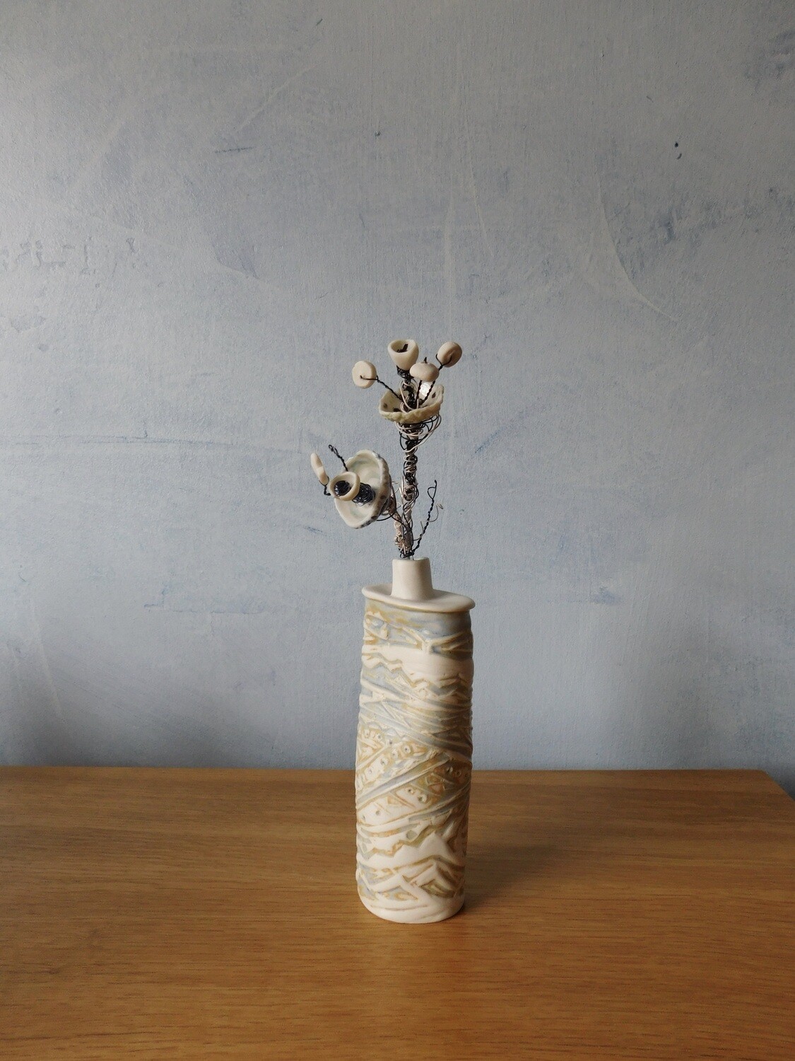 porcelain textured bottle with porcelain flower.