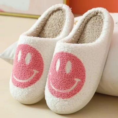 White and pink smiley face slippers