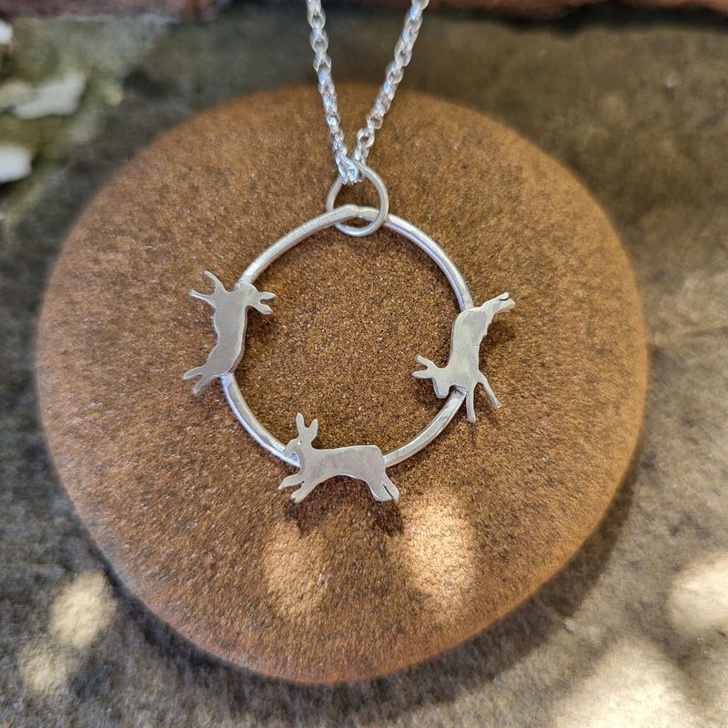 N1793 Trio of Chasing Hares pendant