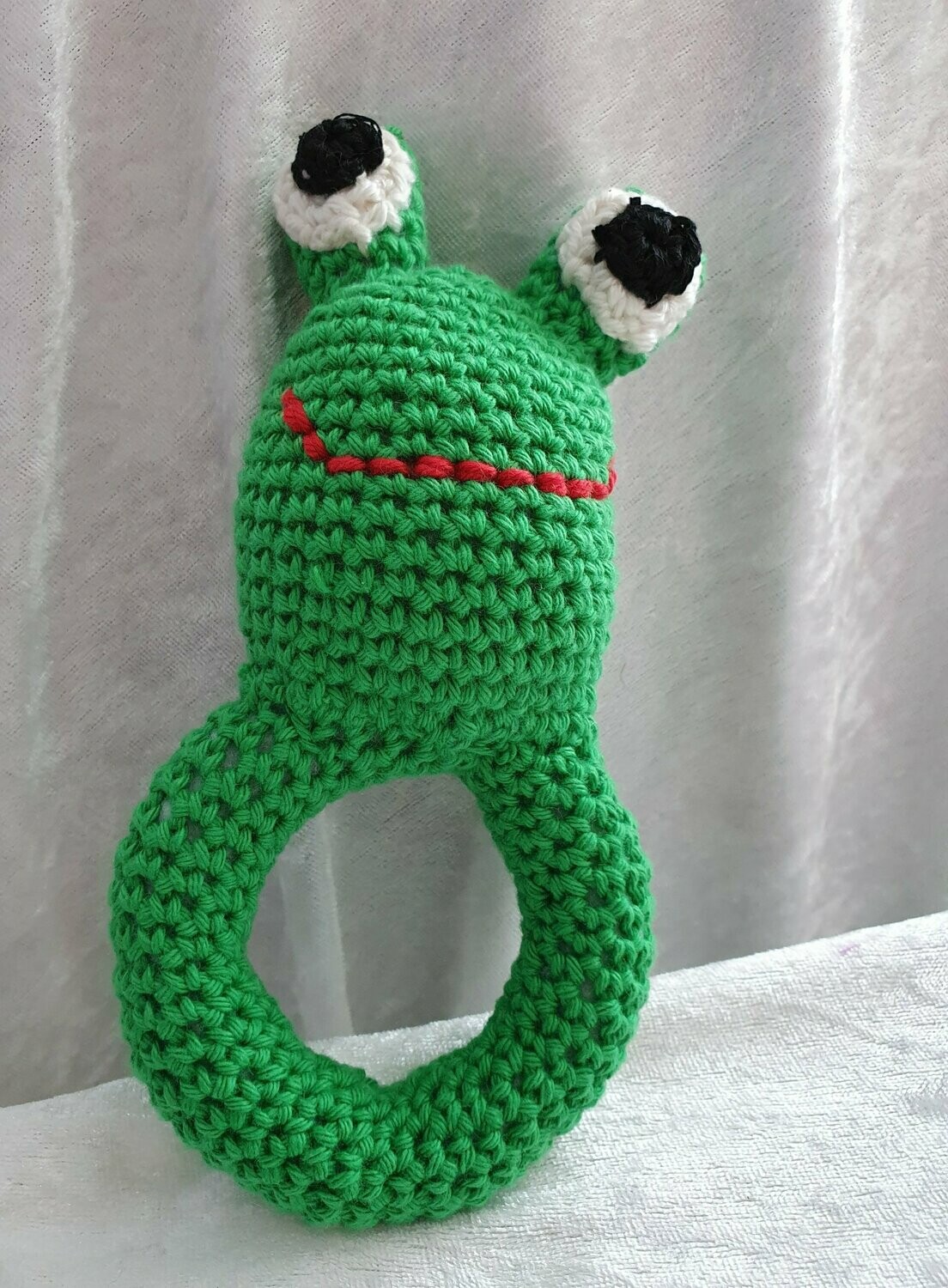 Babyrassel Frosch