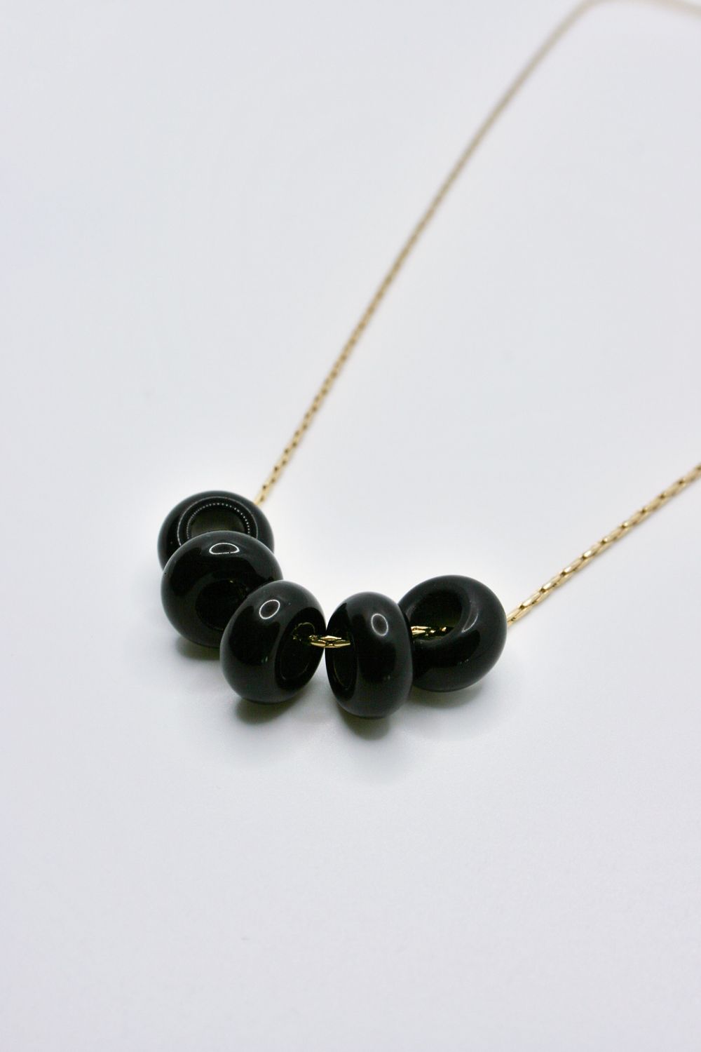 OBSIDIAN HOLE PENDANT