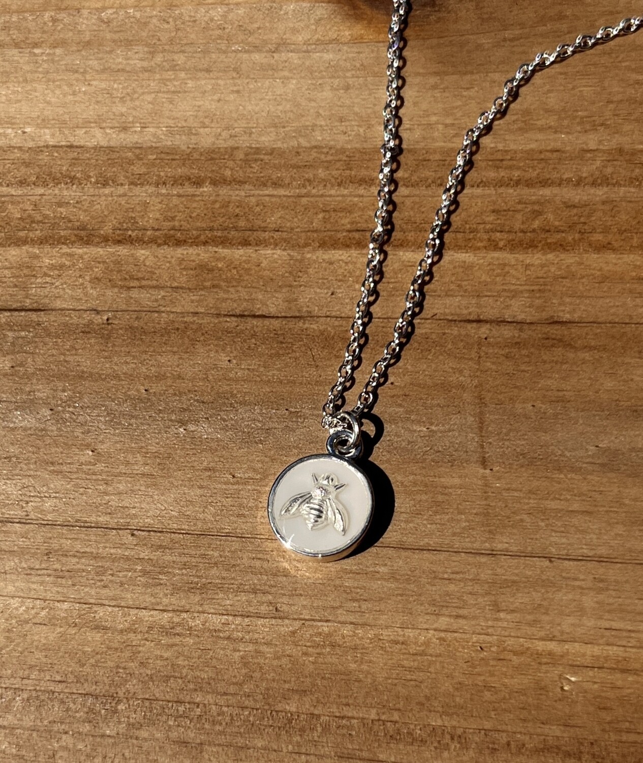 PEACE + PASSION JEWELRY  --  Small Circle Pendant   
--  Bee Charm