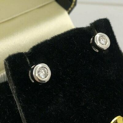 18ct white gold 0.30ct diamond stud earrings in a rub over setting