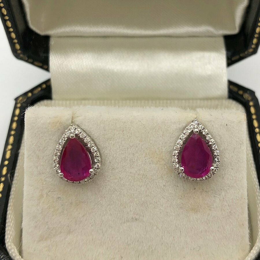 18ct white gold pear shape 1.10ct ruby surrounded with little brilliant cut diamonds