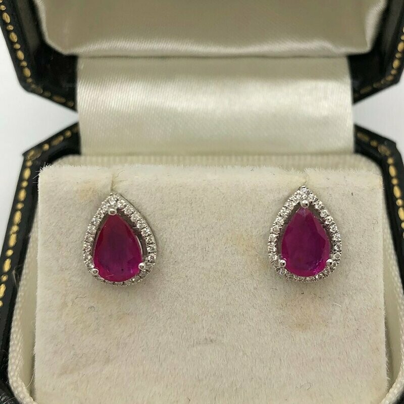 18ct white gold pear shape 1.10ct ruby surrounded with little brilliant cut diamonds