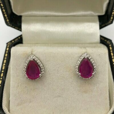 18ct white gold pear shape 1.20ct ruby surrounded with little brilliant cut diamonds