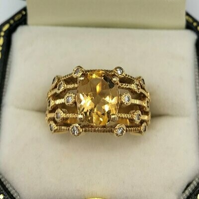 18ct yellow gold ‘Boodles’ inspired 5 band ring with 16 diamonds and a large oval citrine.