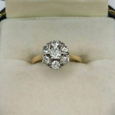 C.1910 18ct yellow gold and platinum daisy ring with old cut diamonds