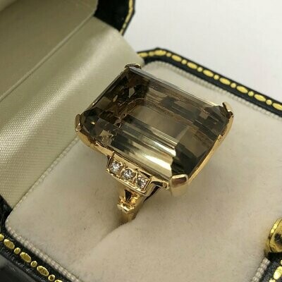 Vintage (C.1970) large emerald cut Smokey quartz cocktail ring with 3 brilliant cut diamonds either side set in 14ct yellow gold