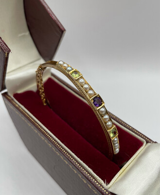 C.1890 15ct Gold Bangle With Peridot, Amethyst And Seed Pearls With Safety Chain.