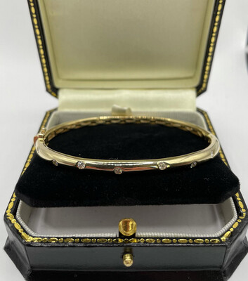 9ct Yellow Gold Bangle With 8 Brilliant Cut Diamonds. Price Available On Request.