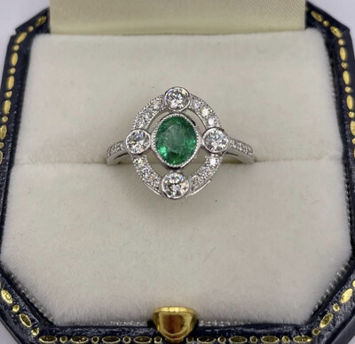 Platinum Oval Emerald and And Diamond Ring.