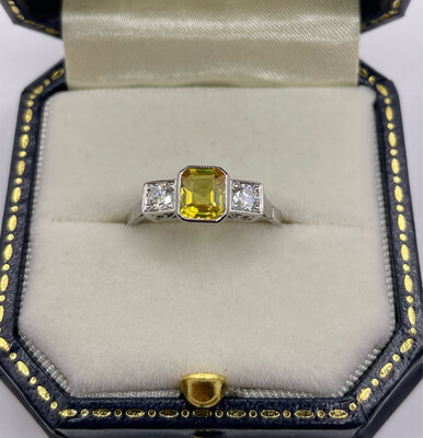 Platinum Yellow Sapphire And Diamond Three Stone Ring.