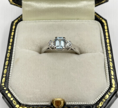 Platinum Emerald Cut Aquamarine And Diamond Pre-loved Three Stone Ring.