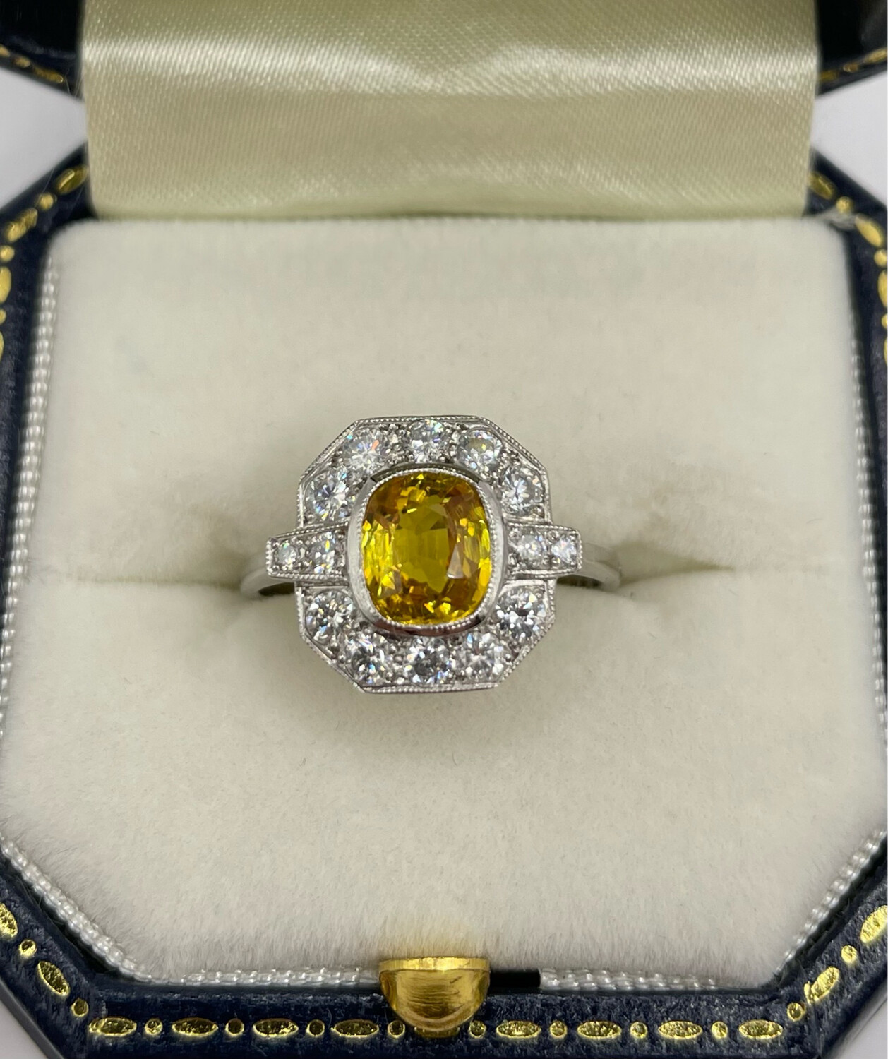 Platinum Deco Style Ring With 1.60ct Gorgeous Yellow Sapphire With .60ct Of Brilliant Cut Diamonds With Two Baguettes.