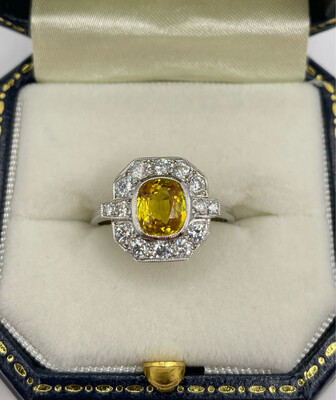 Platinum Deco Style Ring With 1.60ct Gorgeous Yellow Sapphire With .60ct Of Brilliant Cut Diamonds With Two Baguettes.