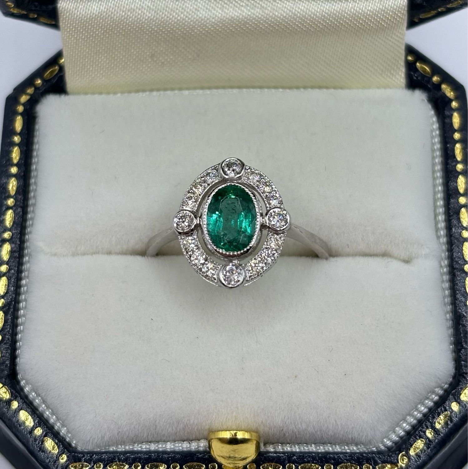 Platinum Oval .80ct Emerald And Diamond Halo Cluster Ring