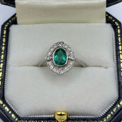 Platinum Oval .80ct Emerald And Diamond Halo Cluster Ring