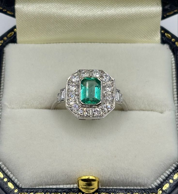 Platinum 1ct Emerald And .70ct Diamond Art deco Design Ring With Baguette Shoulders