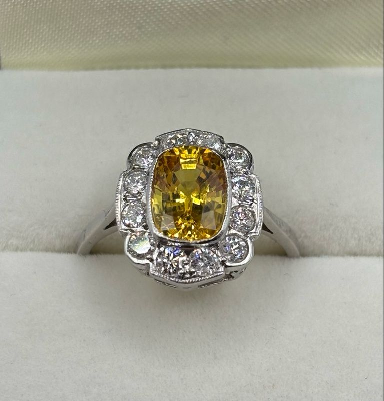 Beautiful 2.10ct Yellow Sapphire And .50ct Diamond Ring Set In Platinum.