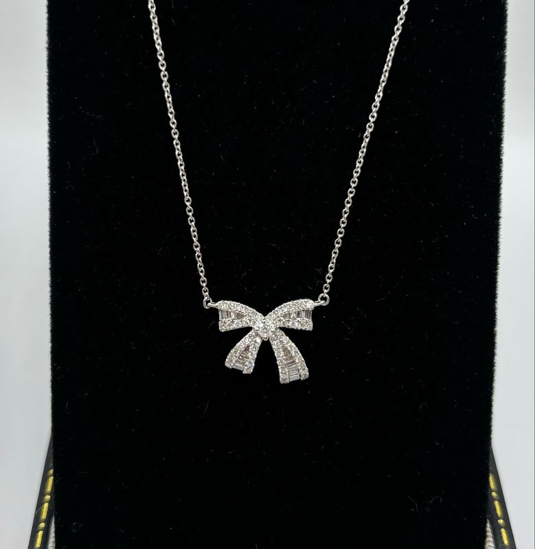 18ct White Gold Baguette And Brilliant Cut Bow Pendant