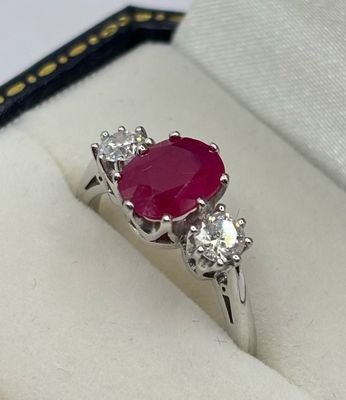 18ct White Golf 1.90ct Oval Ruby & .50ct Brilliant Cut Diamond Three Stone Ring