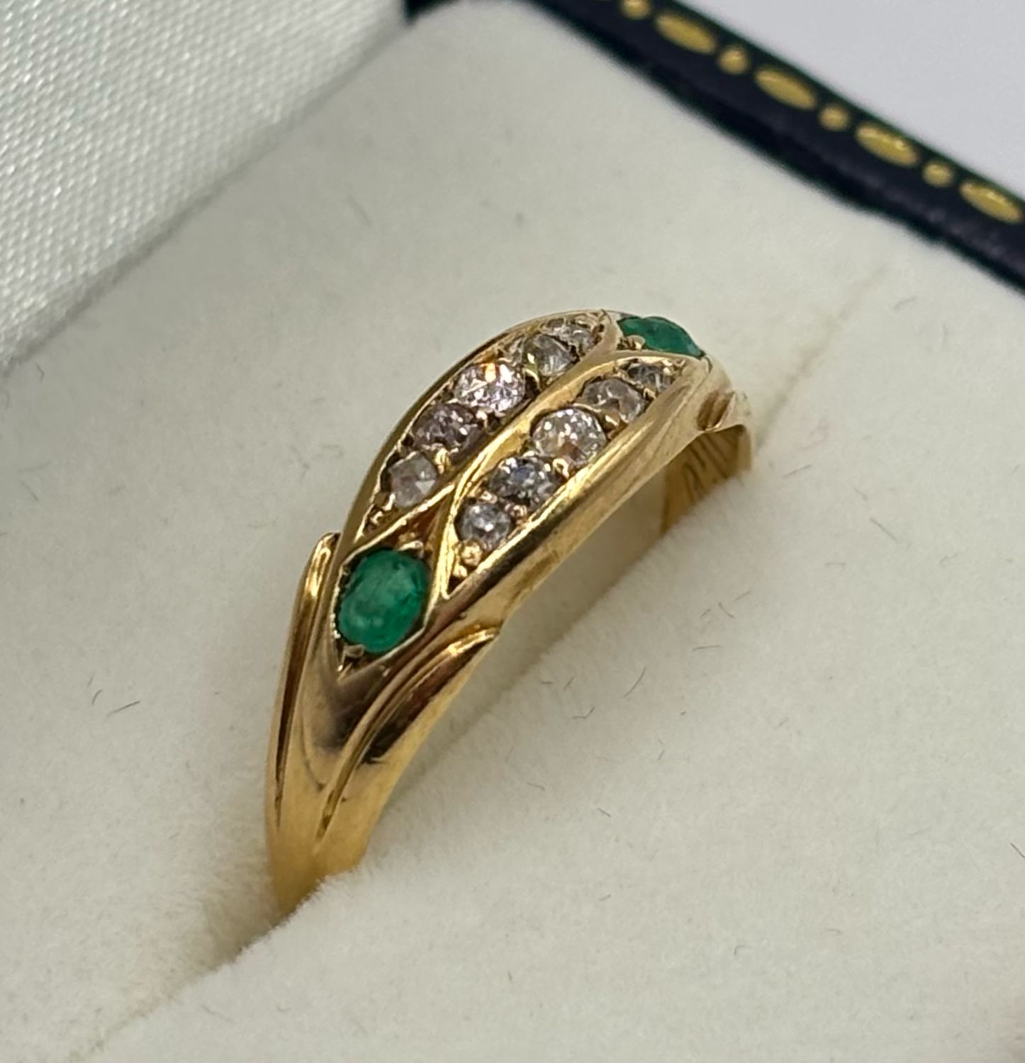 Late Victorian c.1898 18ct Marquise Shape Ring With Two Rows Of Old Cut Diamonds And Two Emeralds.