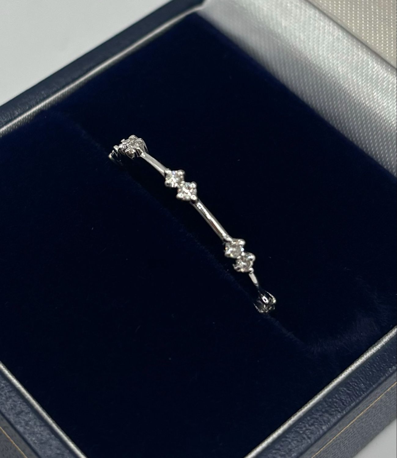 18ct White Gold Thin Band With Eight Diamonds.