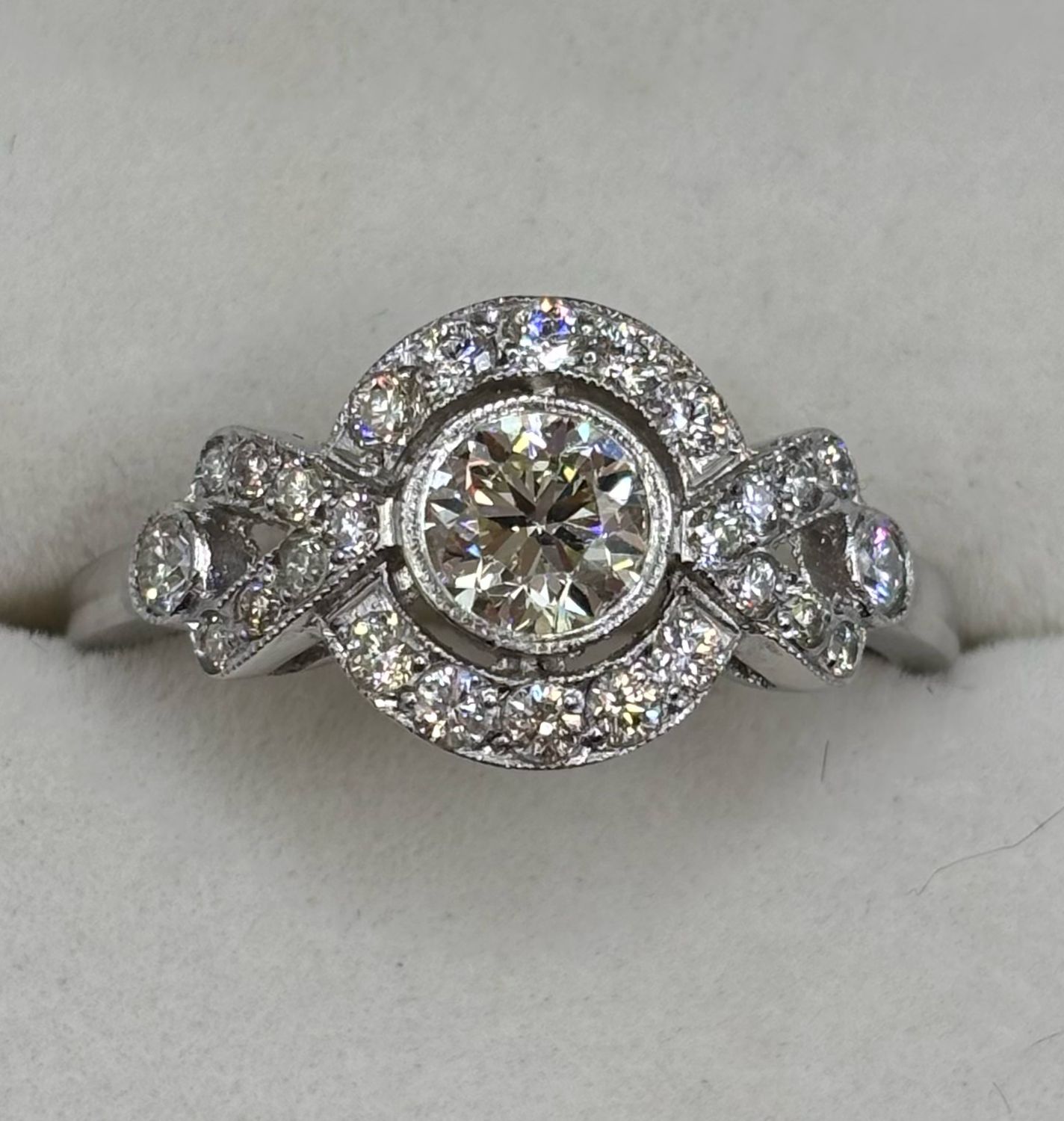 Platinum Halo Ring Brilliant Cut .95ct Diamond With Intricate Sides.