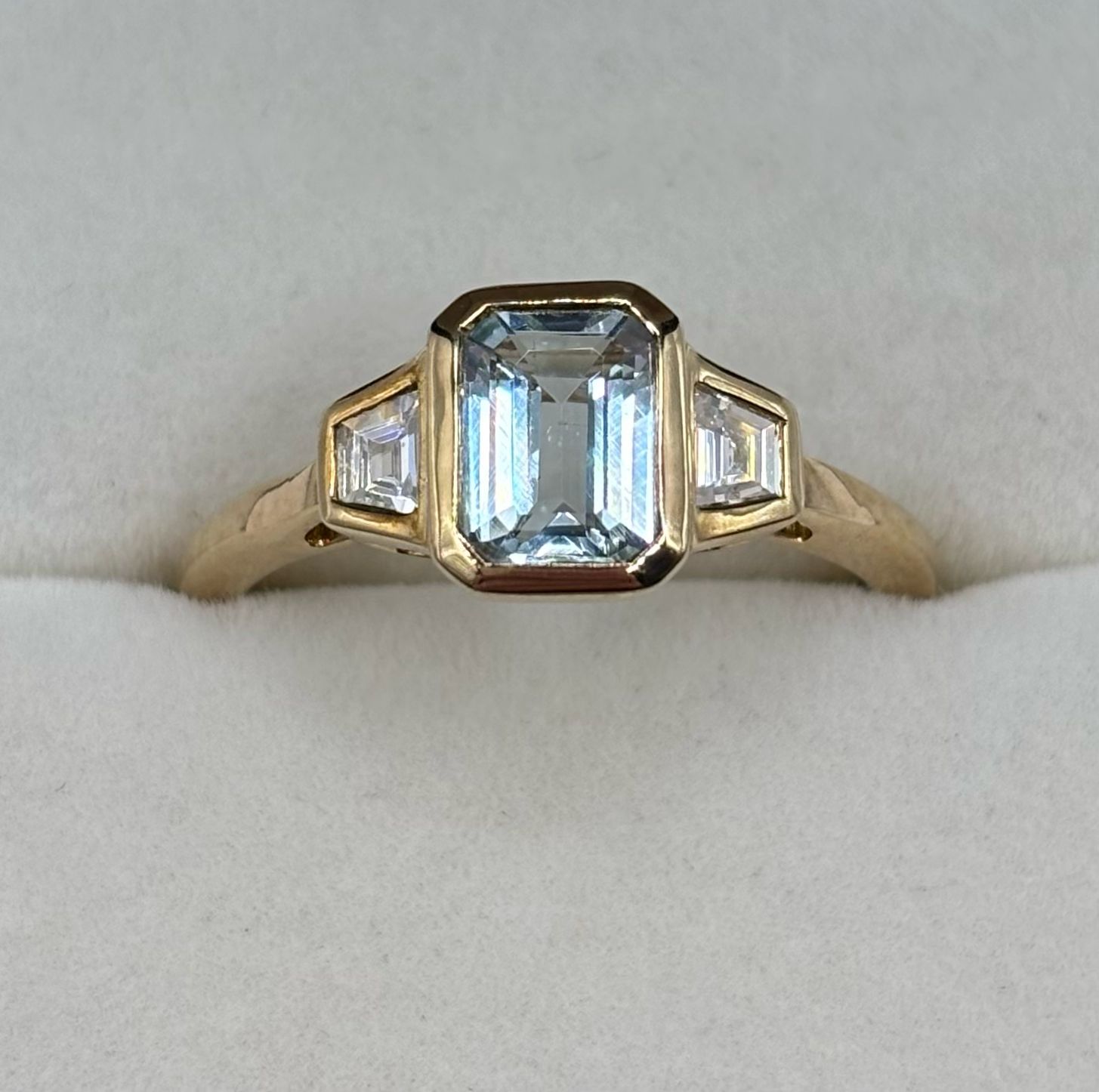 Contemporary 9ct Yellow Gold Bezel Set Ring With Emerald Cut Aquamarine & Baguette Cut Diamonds.