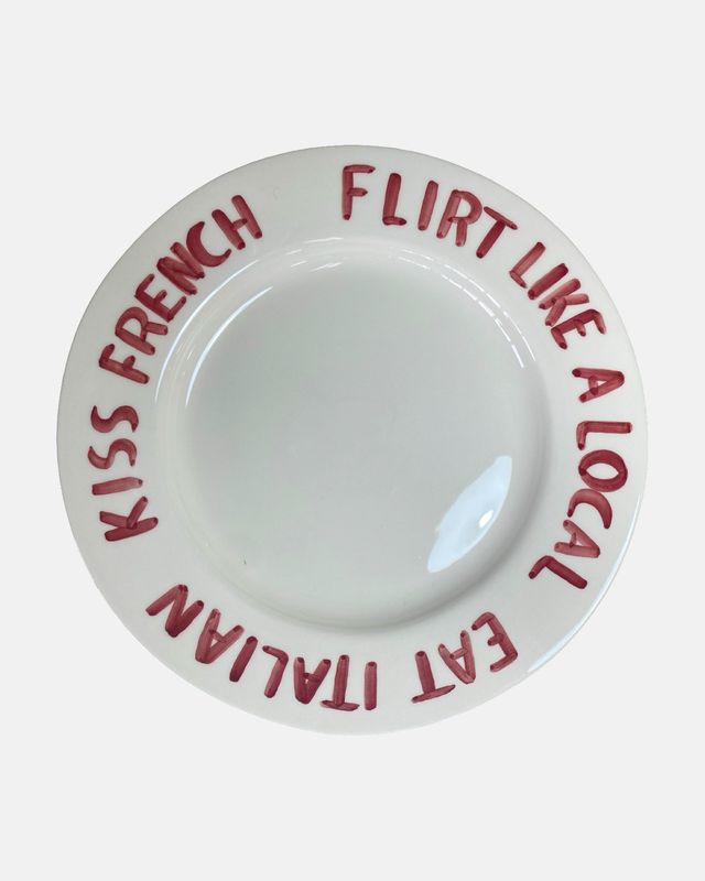 'Eat Italian, kiss French, flirt like a local' bord